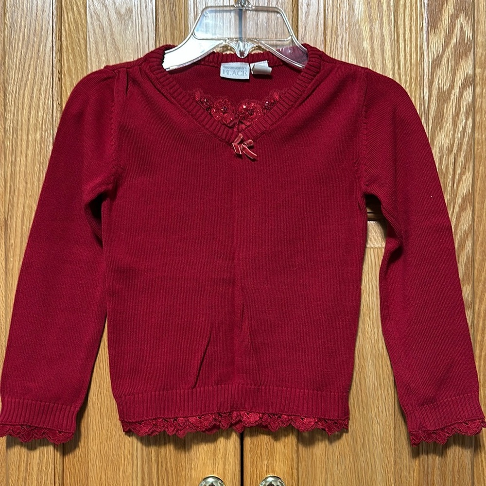 The Children’s Place v-neck top sweater for a girl size 5/6 . 70% cotton.